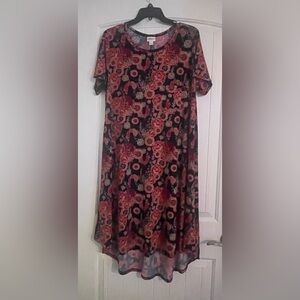 LuLaRoe Carly dress size Large. Pink/ red peacock on dark blue background.